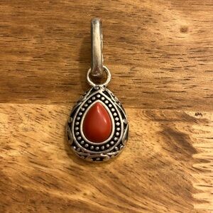 Silver pendant with red coral stone